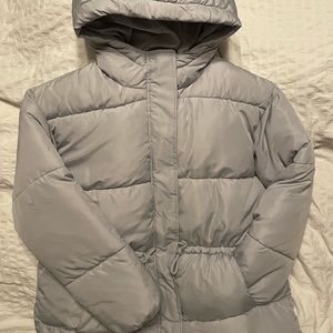 Light/powder blue (irl) puffer jacket. Never worn.